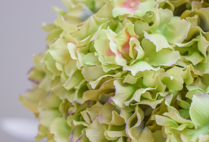 artificial hydrangea in metal pot